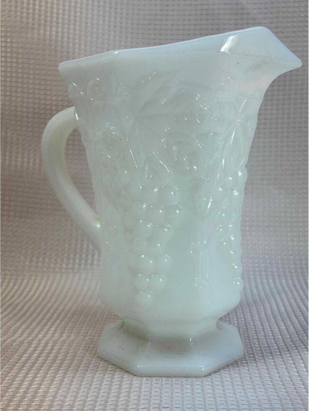 121 - vintage Anchor Hocking milk glass pitcher raised grape and leaf design.